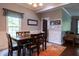 Well-lit dining area featuring dark wood table, trim accents, and inviting decor at 8468 S County Road 575 E, Mooresville, IN 46158