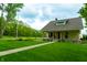 Inviting home with a manicured lawn and cozy porch and charming front facade at 8468 S County Road 575 E, Mooresville, IN 46158