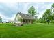Charming home with a covered porch, well-manicured lawn, and mature trees at 8468 S County Road 575 E, Mooresville, IN 46158