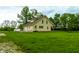 Charming home with a well-manicured lawn and inviting front porch and a bright exterior at 8468 S County Road 575 E, Mooresville, IN 46158
