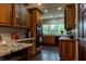 Charming kitchen featuring wood cabinetry, granite countertops, modern appliances and a sunlit window at 8468 S County Road 575 E, Mooresville, IN 46158