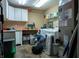Laundry room with white cabinets and a modern washer and dryer unit at 8468 S County Road 575 E, Mooresville, IN 46158