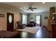 Bright living room featuring wood floors, neutral walls and a brick fireplace at 8468 S County Road 575 E, Mooresville, IN 46158