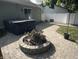 Cozy backyard featuring a patio, hot tub, and fire pit perfect for entertaining at 912 Delray Dr, Indianapolis, IN 46241