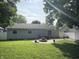 Backyard with a hot tub, fire pit, and patio, ideal for relaxation and entertaining at 912 Delray Dr, Indianapolis, IN 46241
