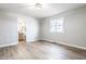 Spacious bedroom with neutral walls and new flooring, with a view to the bathroom at 912 Delray Dr, Indianapolis, IN 46241