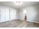 Bright bedroom features neutral walls, new flooring, closet doors, and bathroom access at 912 Delray Dr, Indianapolis, IN 46241