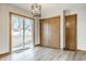 Dining area features new flooring, modern lighting, and sliding glass doors to the backyard at 912 Delray Dr, Indianapolis, IN 46241