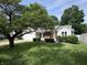 Landscaped front yard and charming exterior of this well-maintained single-Gathering home at 912 Delray Dr, Indianapolis, IN 46241