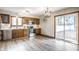 Spacious kitchen with wood cabinets, stainless steel appliances, and sliding glass door to the backyard at 912 Delray Dr, Indianapolis, IN 46241