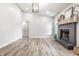 Spacious living area with natural light, fireplace, and stylish laminate flooring at 912 Delray Dr, Indianapolis, IN 46241
