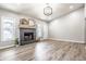 Bright living room featuring a fireplace, decorative accents, and laminate flooring at 912 Delray Dr, Indianapolis, IN 46241