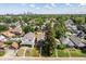 Aerial view of home with mature trees and a cityscape in the distance at 920 E Tabor St, Indianapolis, IN 46203
