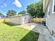 A spacious backyard showcasing the property's exterior and a newly installed wooden fence for added privacy at 920 E Tabor St, Indianapolis, IN 46203