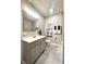 Neutral bathroom features a stylish vanity, gray subway tile, and modern fixtures at 920 E Tabor St, Indianapolis, IN 46203