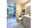 Bright bathroom offers a vanity, shower with blue curtain, and tasteful decor at 920 E Tabor St, Indianapolis, IN 46203