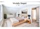 Staged bedroom featuring a modern bed, a large window, and neutral decor at 920 E Tabor St, Indianapolis, IN 46203