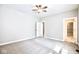 Expansive bedroom with neutral carpet, ceiling fan, walk-in closet, and ample space at 920 E Tabor St, Indianapolis, IN 46203