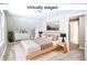 Bright, staged bedroom with sloped ceilings, neutral tones, and plenty of natural light at 920 E Tabor St, Indianapolis, IN 46203