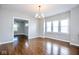 Dining area with natural light featuring an elegant chandelier and hardwood floors at 920 E Tabor St, Indianapolis, IN 46203
