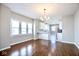 Dining area featuring natural light, an elegant chandelier, and an open concept at 920 E Tabor St, Indianapolis, IN 46203