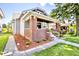 Beautifully landscaped front yard with brick accents highlighting the covered front porch at 920 E Tabor St, Indianapolis, IN 46203