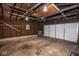 Empty garage with unpainted wooden walls showcasing its potential for parking, storage, and home improvement projects at 920 E Tabor St, Indianapolis, IN 46203