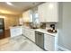 Spacious kitchen with white cabinets, stainless steel appliances, and modern countertops at 920 E Tabor St, Indianapolis, IN 46203