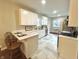 Charming kitchen has updated appliances, marble countertops, and an open layout at 920 E Tabor St, Indianapolis, IN 46203