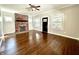 Living room featuring a brick fireplace, wood floors, neutral paint, and recessed lighting at 920 E Tabor St, Indianapolis, IN 46203