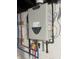 Close-up of modern wall-mounted water heater system at 920 E Tabor St, Indianapolis, IN 46203