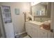 Charming bathroom with vanity, framed mirror, decorative shelves, and fresh decor at 9774 Foxboro Ln, Fishers, IN 46038