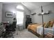 Cozy bedroom with natural light, neutral tones, and ample space for work or relaxation at 9774 Foxboro Ln, Fishers, IN 46038