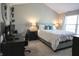 Bright bedroom with a comfortable bed, ample natural light, and a dedicated workspace at 9774 Foxboro Ln, Fishers, IN 46038