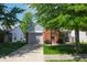 Charming single Gathering home with brick facade, attached garage, and well-maintained front yard at 9774 Foxboro Ln, Fishers, IN 46038