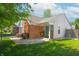 Charming single Gathering home with brick facade, attached garage, and well-maintained front yard at 9774 Foxboro Ln, Fishers, IN 46038
