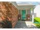 Close up on the front entry with teal door and potted flowers at 9774 Foxboro Ln, Fishers, IN 46038