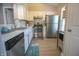 Well-lit kitchen boasts stainless steel appliances, ample counter space, and white cabinets at 9774 Foxboro Ln, Fishers, IN 46038