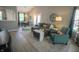 Comfortable living room with dining area, large sectional, and bright natural light at 9774 Foxboro Ln, Fishers, IN 46038