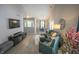Bright living room features vaulted ceilings, modern decor, and open floor plan at 9774 Foxboro Ln, Fishers, IN 46038