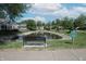 Neighborhood pond with bench and rules signage at 9774 Foxboro Ln, Fishers, IN 46038