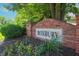 Neighborhood signage in brick with planted flowers reads ROXBURY at 9774 Foxboro Ln, Fishers, IN 46038