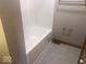 Clean bathroom featuring a tub with tile flooring and a chrome towel rack at 1045 Springway Dr, Shelbyville, IN 46176