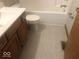 Bathroom featuring tile floor, tub and shower combo and wood vanity at 1045 Springway Dr, Shelbyville, IN 46176