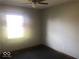 Bedroom featuring neutral walls, a window offering natural light, and carpeted flooring at 1045 Springway Dr, Shelbyville, IN 46176