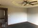 Bedroom with ceiling fan and neutral colored walls and carpeting at 1045 Springway Dr, Shelbyville, IN 46176