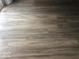 Close up image of the laminate flooring in the dining room at 1045 Springway Dr, Shelbyville, IN 46176