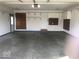 Spacious garage with shelving and storage, offering ample room for vehicles and equipment at 1045 Springway Dr, Shelbyville, IN 46176