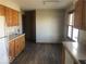 Traditional kitchen featuring wood cabinets, laminate countertops, and vinyl plank flooring at 1045 Springway Dr, Shelbyville, IN 46176