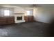 Large living room featuring a fireplace, built-in shelving, and two large windows at 1045 Springway Dr, Shelbyville, IN 46176